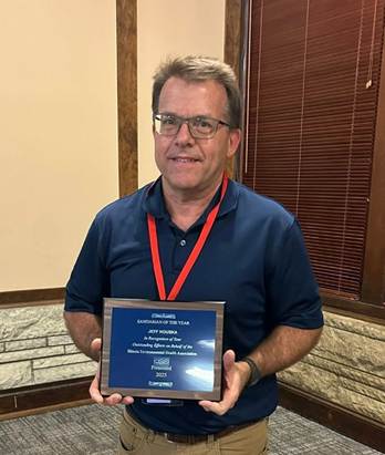 A person holding a plaque

AI-generated content may be incorrect.